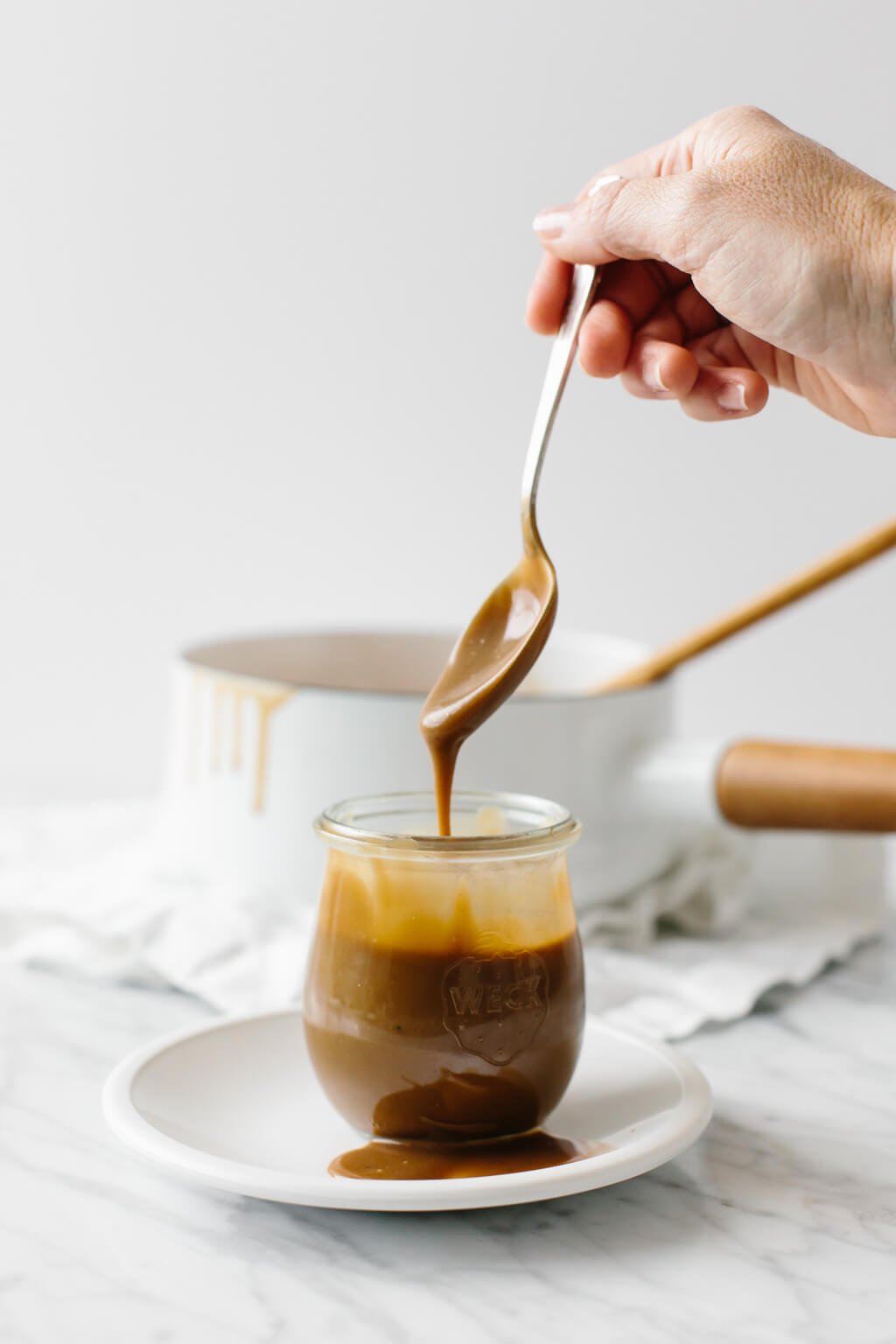 Salted caramel sauce that's made from coconut milk and coconut sugar. It's a dairy-free, paleo and vegan caramel sauce. And it's extremely delicious! #CaramelSauce #Salted CaramelSauce #VeganCaramelSauce #CaramelSauceRecipe