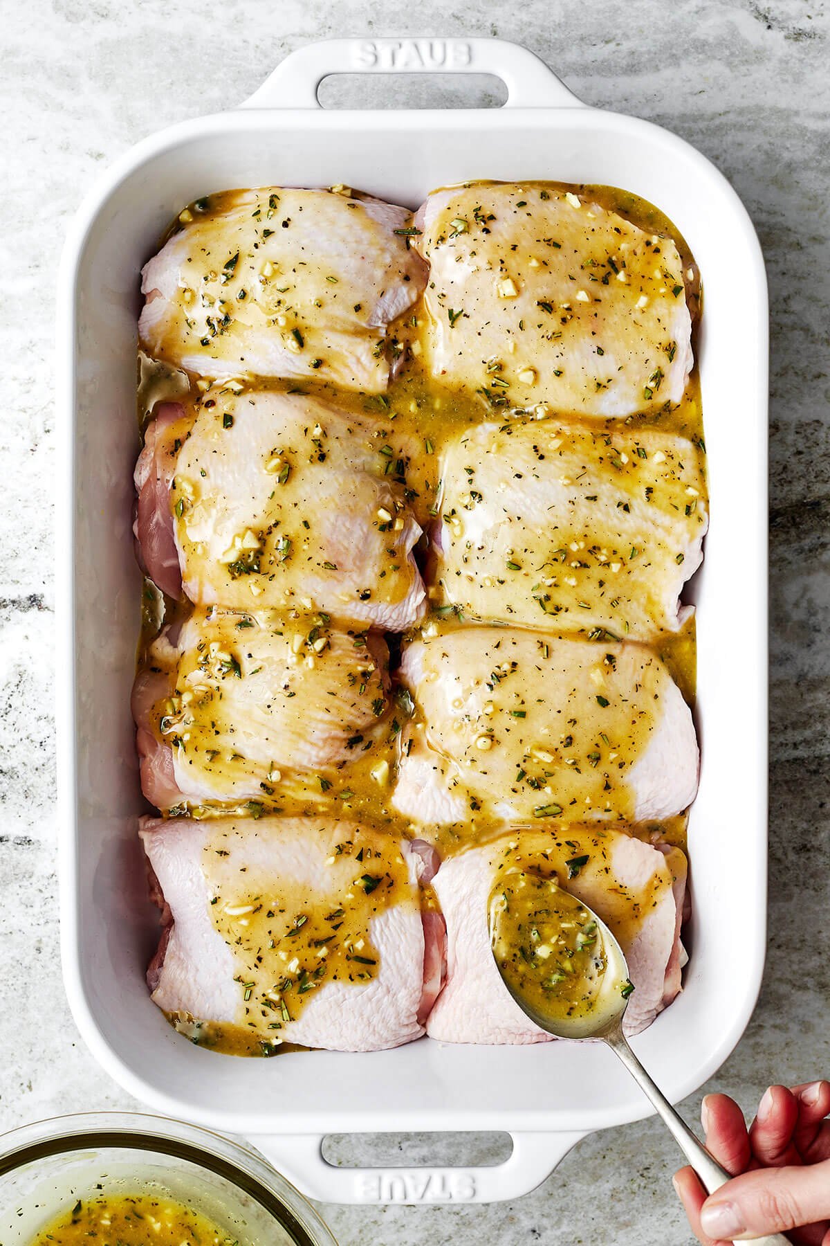 These honey mustard chicken thighs are just what you need to jazz up weeknight dinners! They're extra flavorful, juicy, and crisp. Honey mustard chicken thighs in a dish before baking