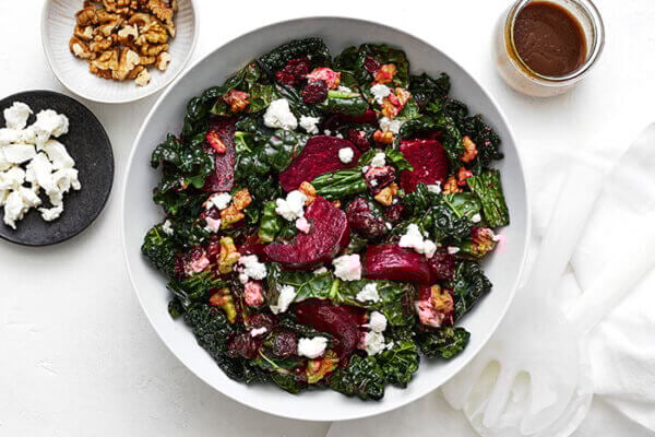 A large serving bowl of roasted beet salad