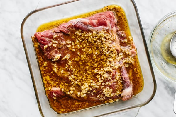 Marinating steak in a glass container for steak fajitas