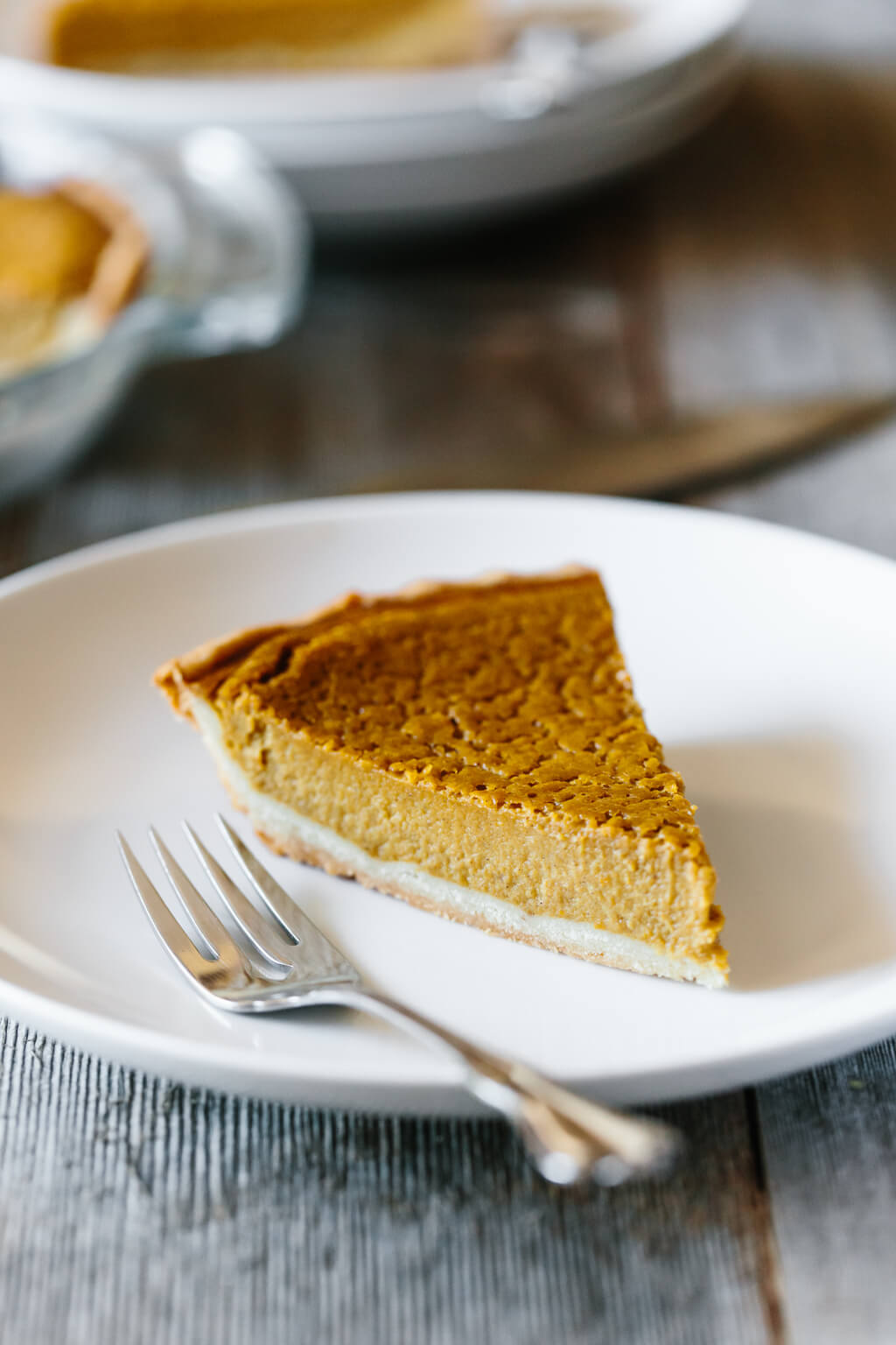 Single slice of paleo pumpkin pie on a plate.