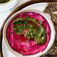 Beet hummus is made with oven roasted beets, chickpeas, tahini, olive oil, lemon juice and garlic. It's a vibrant and healthy snack or appetizer recipe.