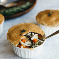 Paleo chicken pot pies that are mini in size and loaded with veggies, shredded chicken and a creamy, dairy-free filling.  They're gluten-free, grain-free, dairy-free and paleo - though you'd never know it.