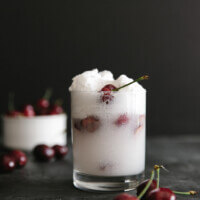Spiked coconut cherry float (dairy-free, vegan). The perfect cocktail or summertime drink with just a smidge of alcohol.