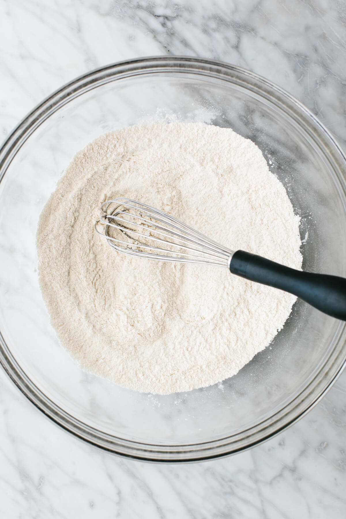 Mixing cassava flour tortilla in a bowl with a whisk