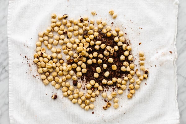 Rubbing skins of hazelnuts for homemade Nutella.