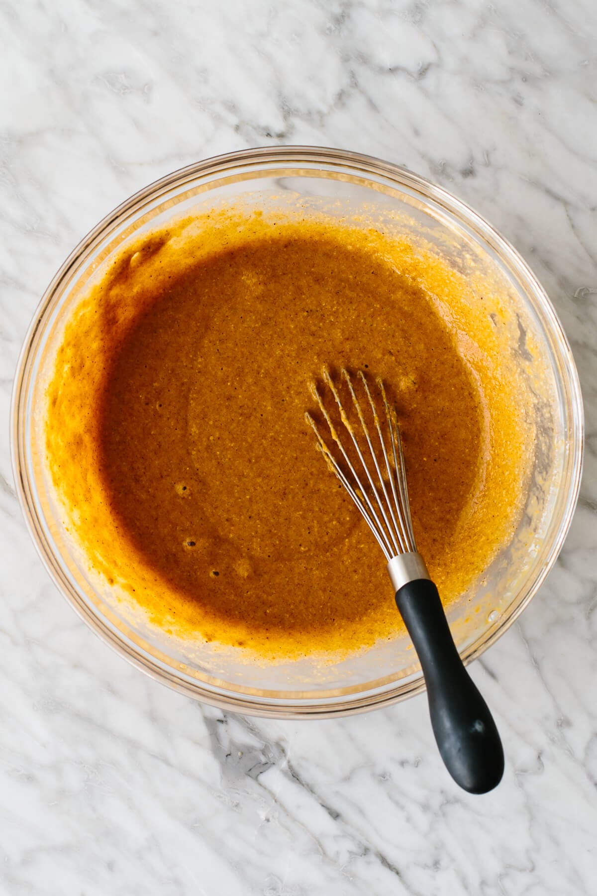 Paleo pumpkin pancake batter mixed together in a bowl. 