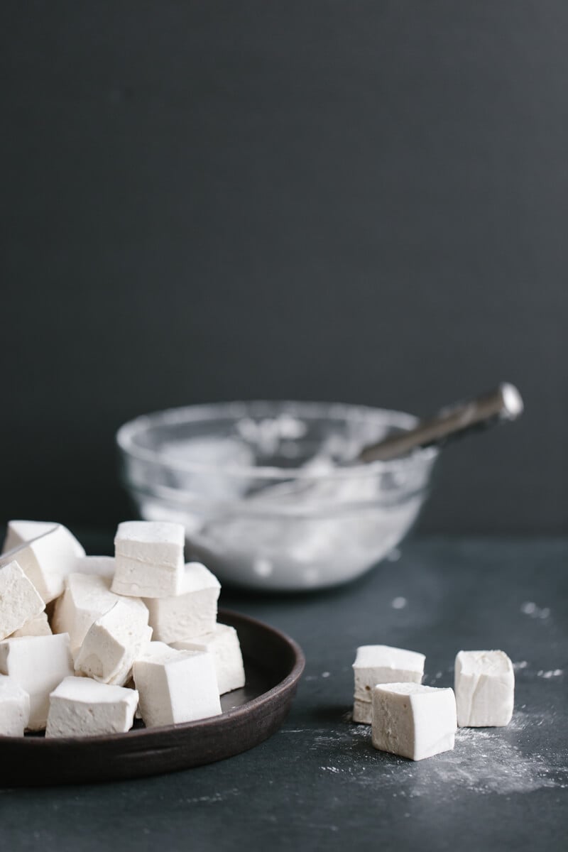Healthier homemade marshmallows use honey or maple syrup instead of corn syrup and high-quality gelatin. They're also paleo friendly. 