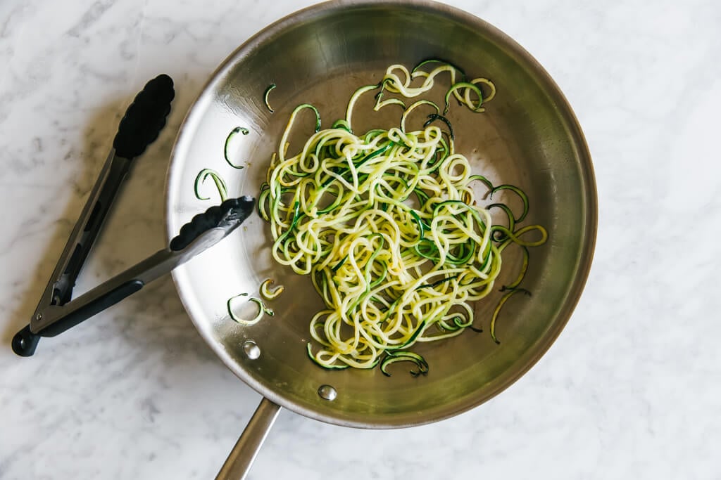 Zucchini noodles in a saute pan.