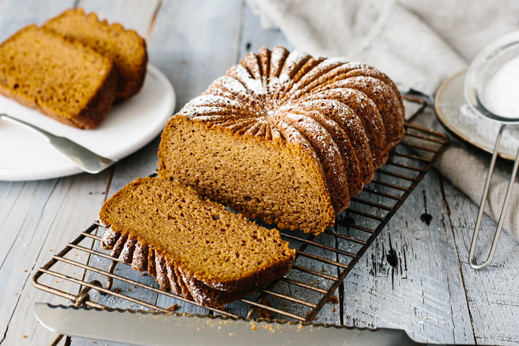 The best part about this recipe is that it only takes one bowl. Just add all the ingredients into a mixing bowl and use a hand mixer to quickly blend everything together. Pour it into your loaf pan (you can get fancy with this loaf pan) and place it in the oven. Super easy. When it comes out of the oven your kitchen will smell divine. And needless to say, it's the perfect breakfast bread to serve up for Thanksgiving. Or any fall weekend. Paleo pumpkin bread cooling on a wire rack.