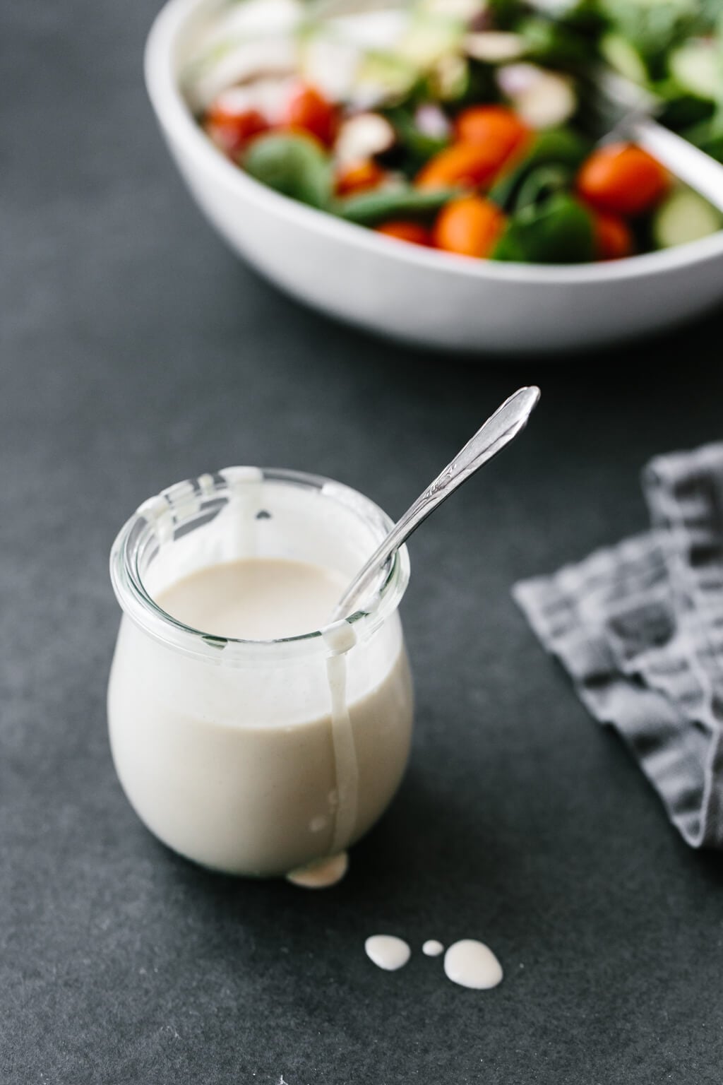 This lemon tahini dressing is oil-free, dairy-free and vegan. It's a tasty, creamy, zesty salad dressing that's super versatile and adaptable. #LemonTahiniDressing #Tahini