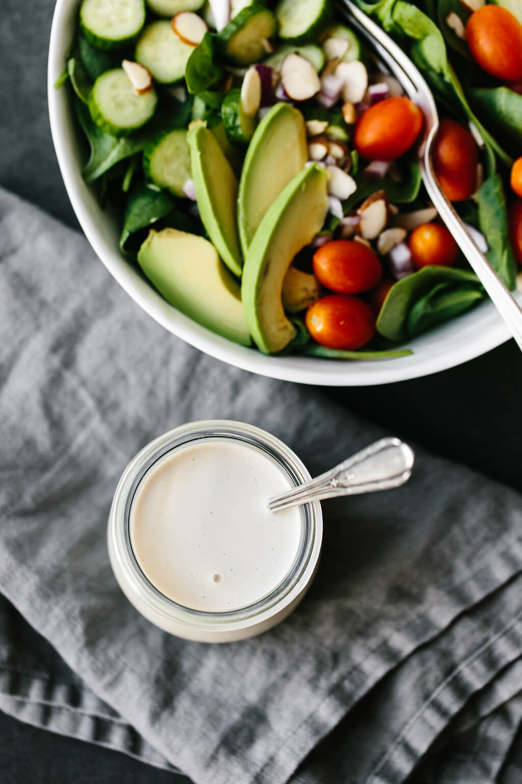 This lemon tahini dressing is oil-free, dairy-free and vegan. It's a tasty, creamy, zesty salad dressing that's super versatile and adaptable. #LemonTahiniDressing #Tahini