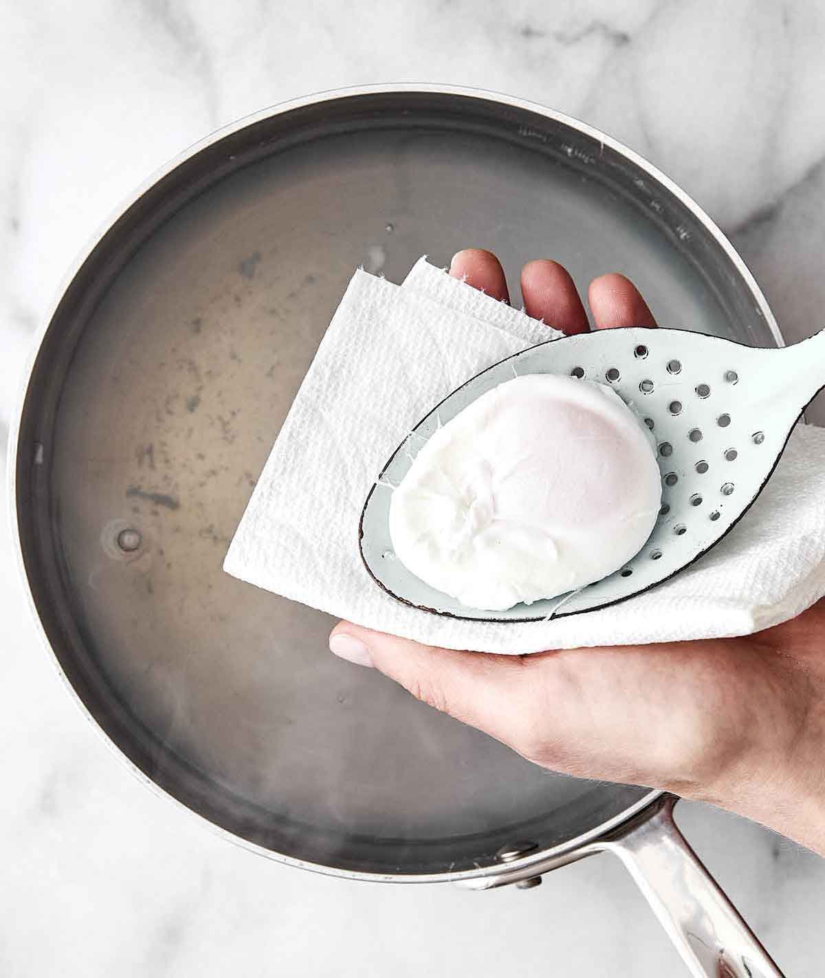 Learn how to make perfect poached eggs every time with this easy method! It'll be a delicious addition to a healthy breakfast. Step four of poached eggs: Remove the egg.