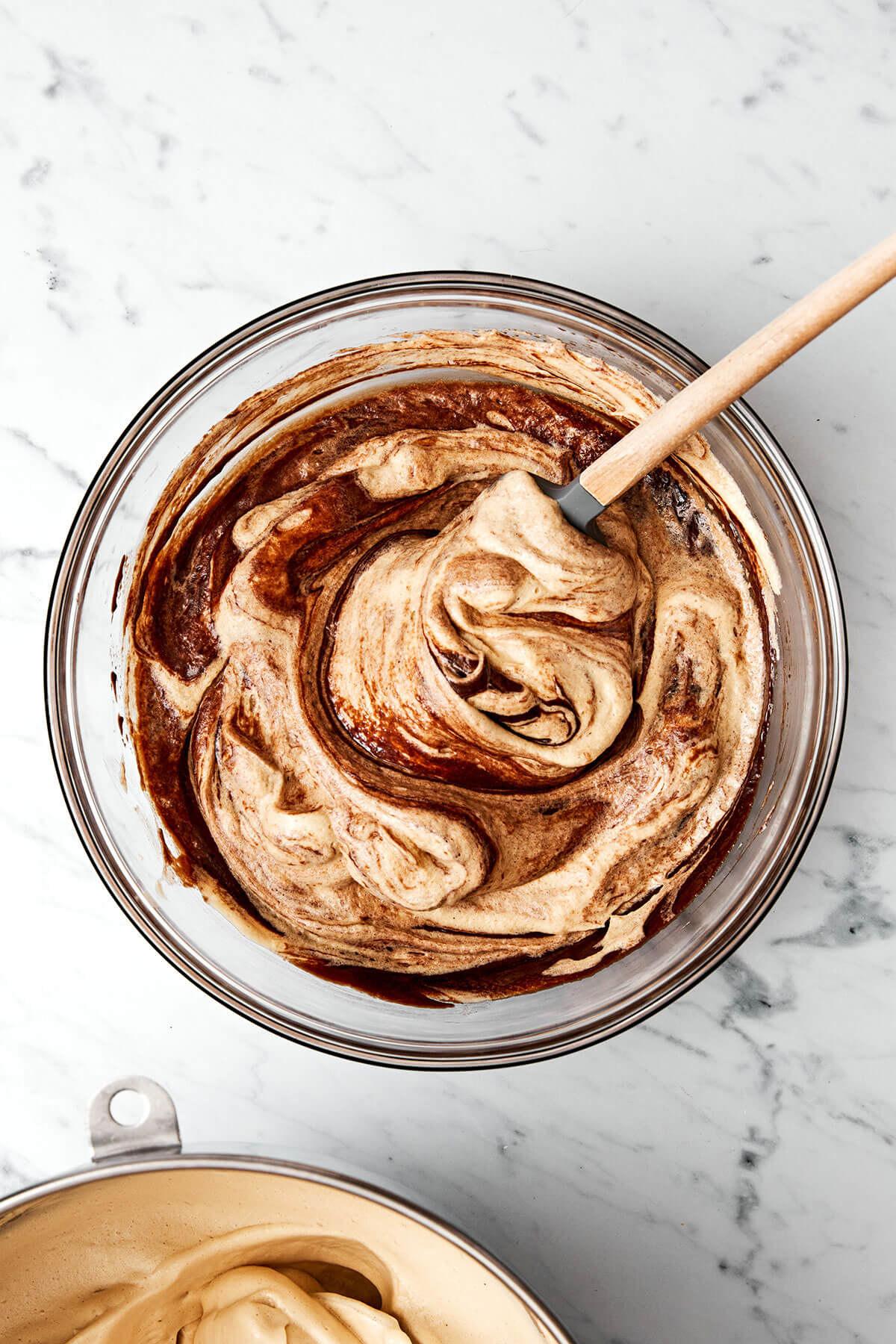 This flourless chocolate cake is a deliciously elegant yet easy chocolate dessert that’s sure to impress guests. Mixing chocolate and egg whites together.