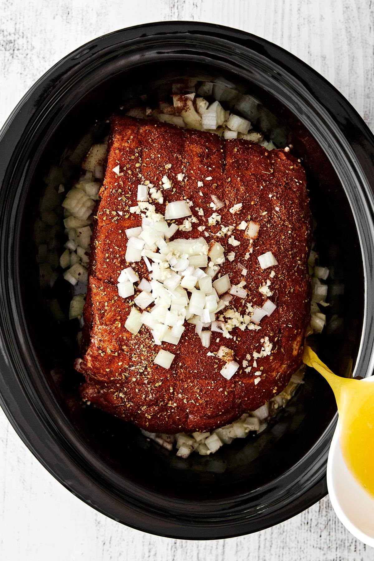 Prepping slow cooker pulled pork.