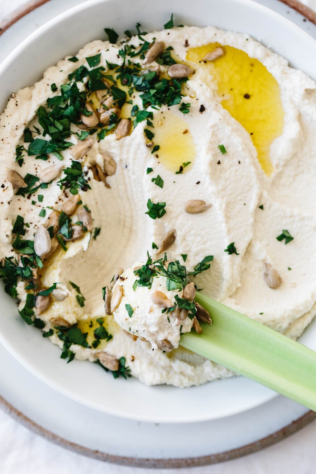 Roasted cauliflower hummus is a delicious chickpea-free version of hummus that's low-carb, keto, paleo and Whole30 friendly.