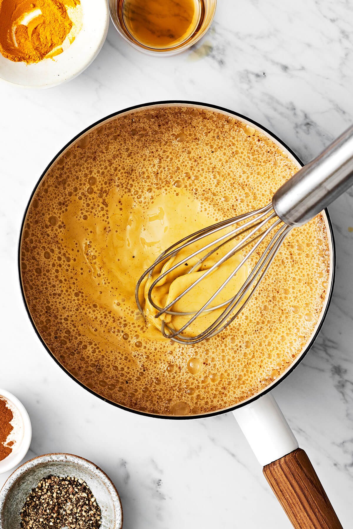 Golden milk (turmeric milk) reigns supreme for a healthy, healing, and anti-inflammatory drink! Bonus — it's super delicious. Mixing golden milk in a pot with a whisk