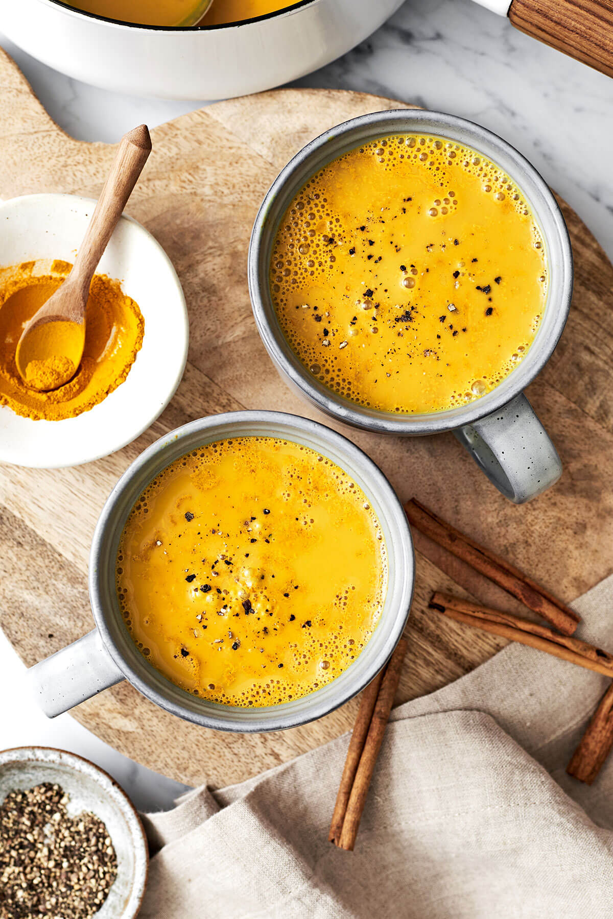 Golden milk (turmeric milk) reigns supreme for a healthy, healing, and anti-inflammatory drink! Bonus — it's super delicious. Mugs of turmeric golden milk