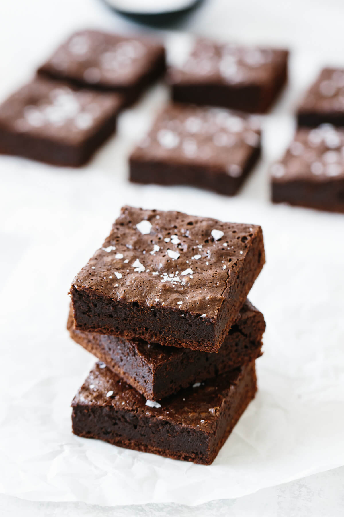 Several paleo brownies on a table.