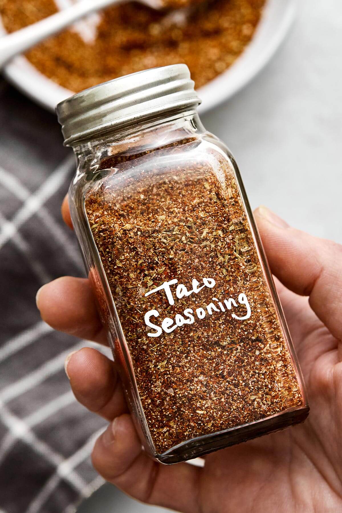 This taco seasoning will beat the store-bought version any day! It's super easy, inexpensive, and doesn't container filler ingredients. A jar of taco seasoning.