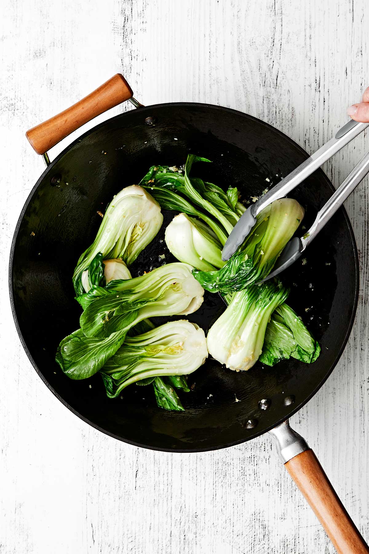 Bok choy in a wok.