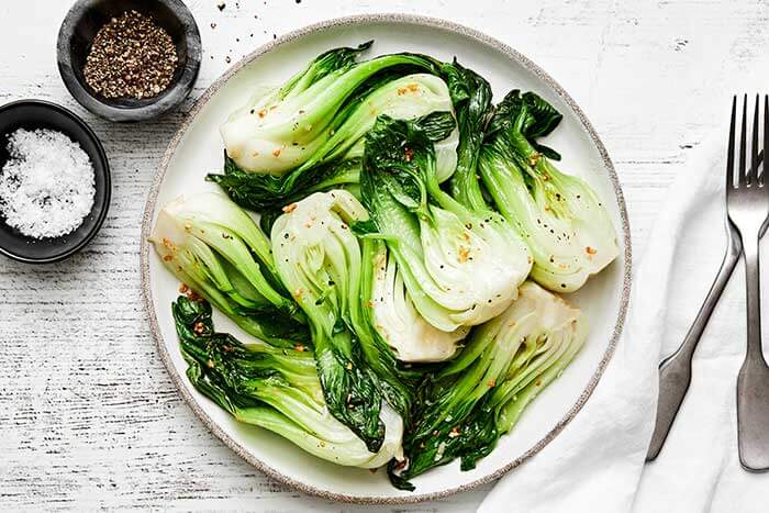 Stir-fry bok choy on a plate.