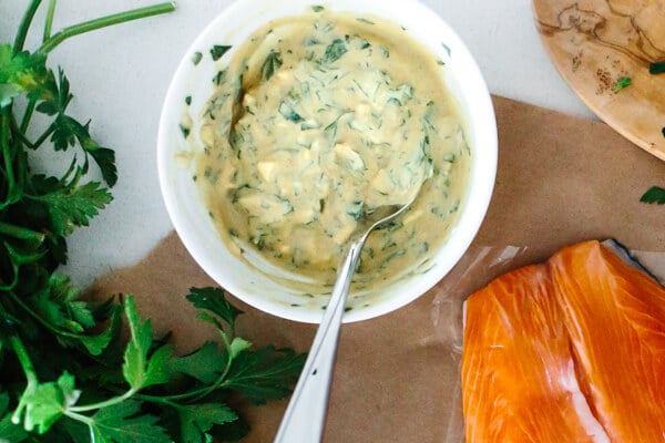 Mixing sauce in a bowl for dijon baked salmon.