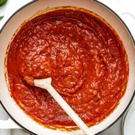 A white pot of homemade marinara sauce