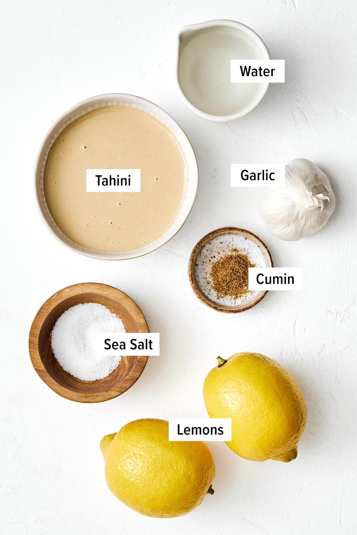 This authentic tahini sauce is easy to make with only a handful of ingredients. Drizzle on falafels, kabobs, roasted vegetables, and more! Ingredients for tahini sauce.