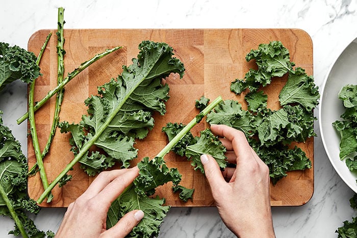 Prepping kale for salad.