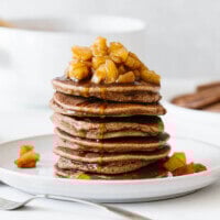 Stack of apple cinnamon pancakes with maple apple cinnamon topping.