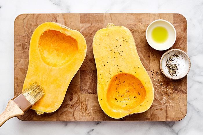 Seasoning butternut squash.