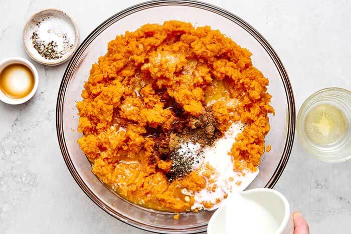 Making a sweet potato mash in a bowl.