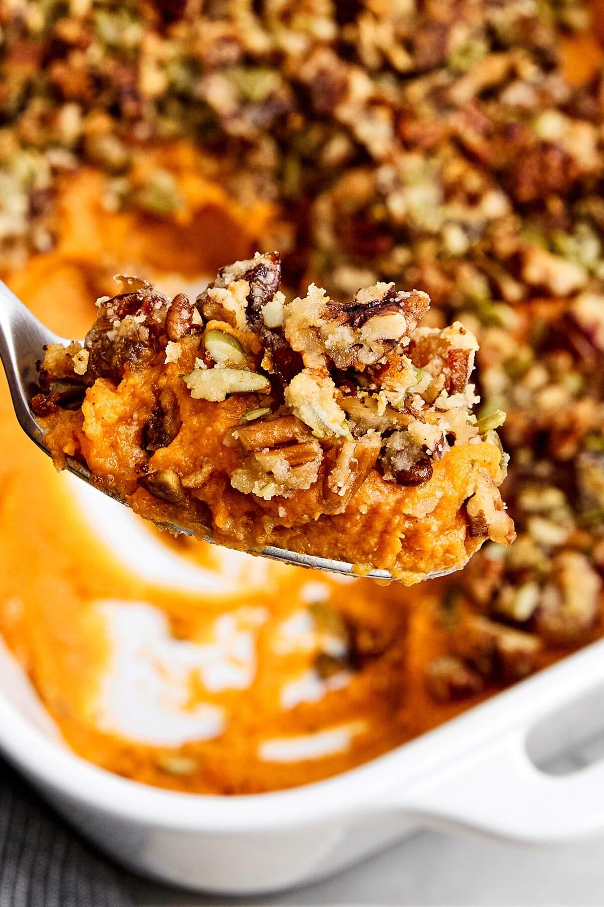 A scoop of sweet potato casserole.