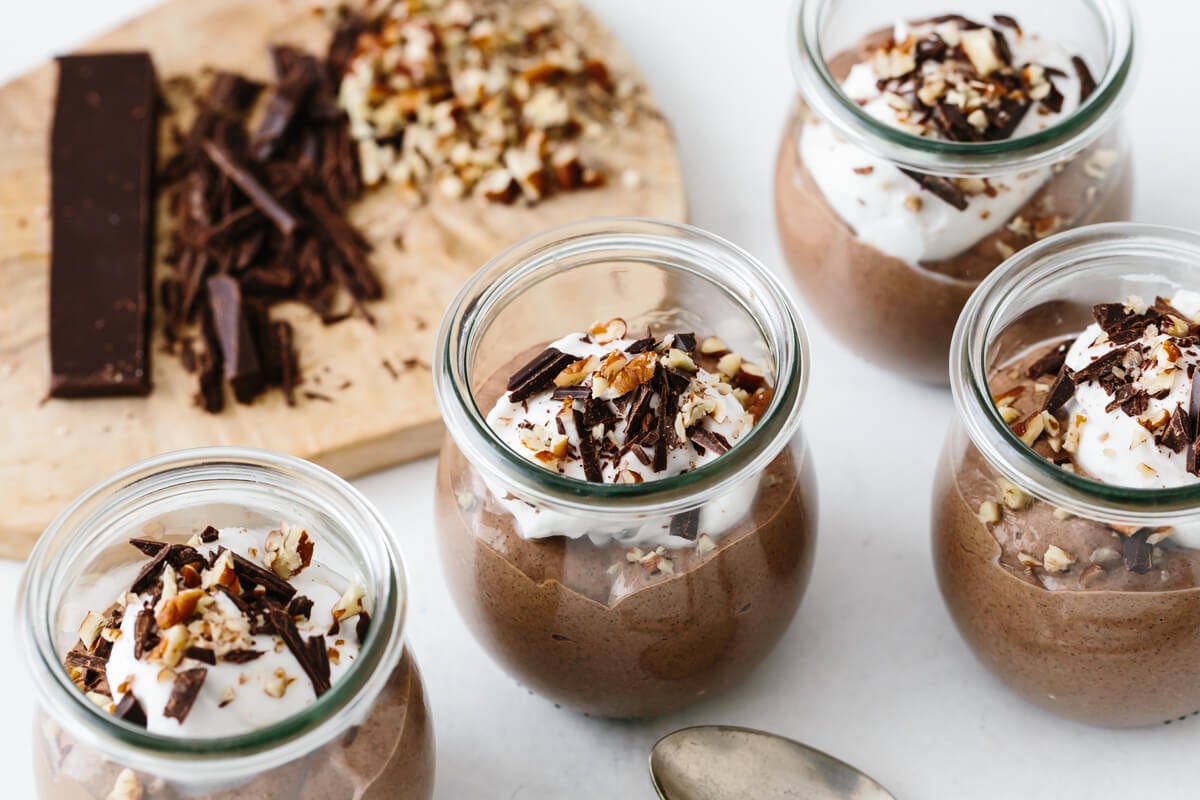 Adding toppings to chocolate chia pudding mousse recipe.