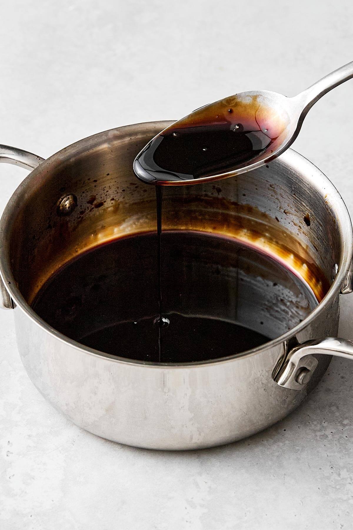 Making balsamic glaze in a pot.