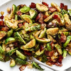 A white platter of balsamic bacon Brussels sprouts.
