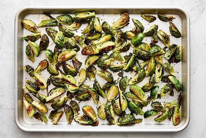 A sheet pan of roasted Brussels sprouts.