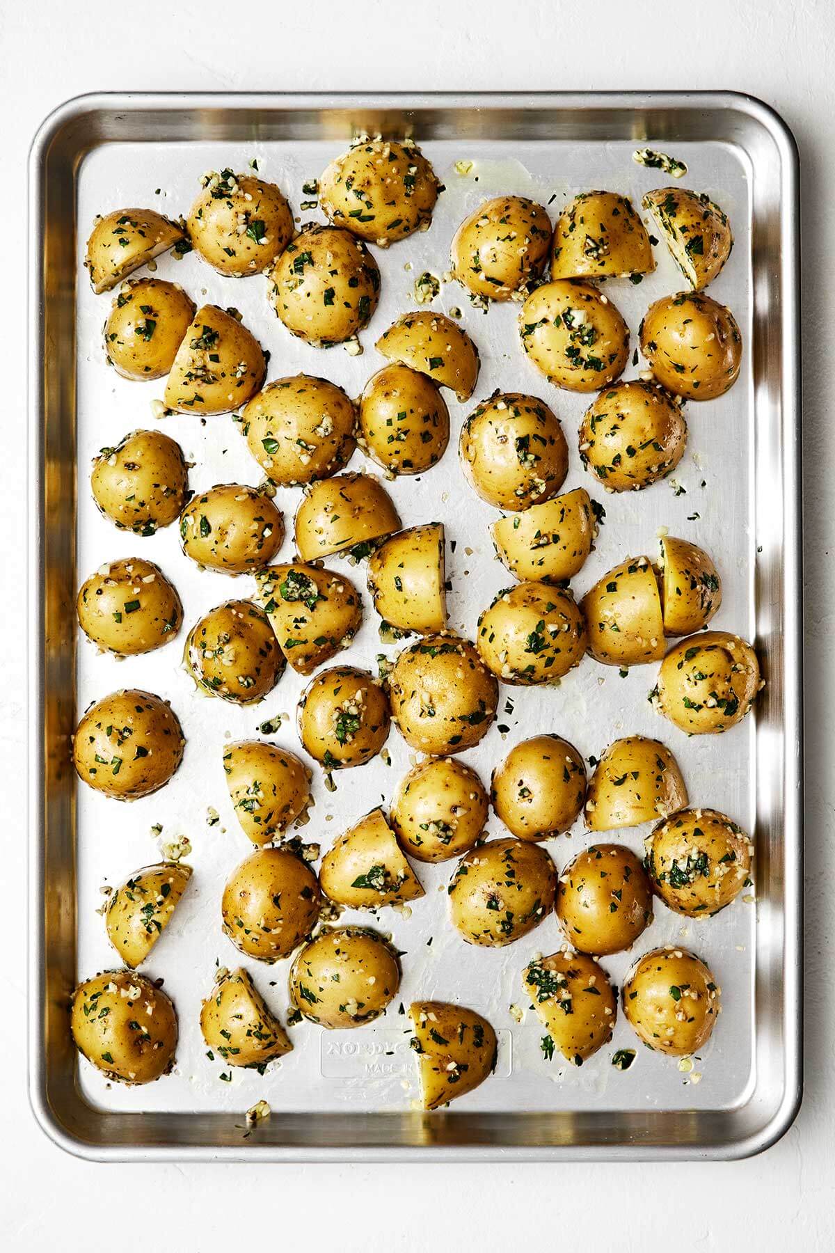 Garlic roasted potatoes on a sheet pan.
