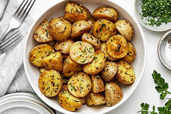 A bowl of roasted potatoes.