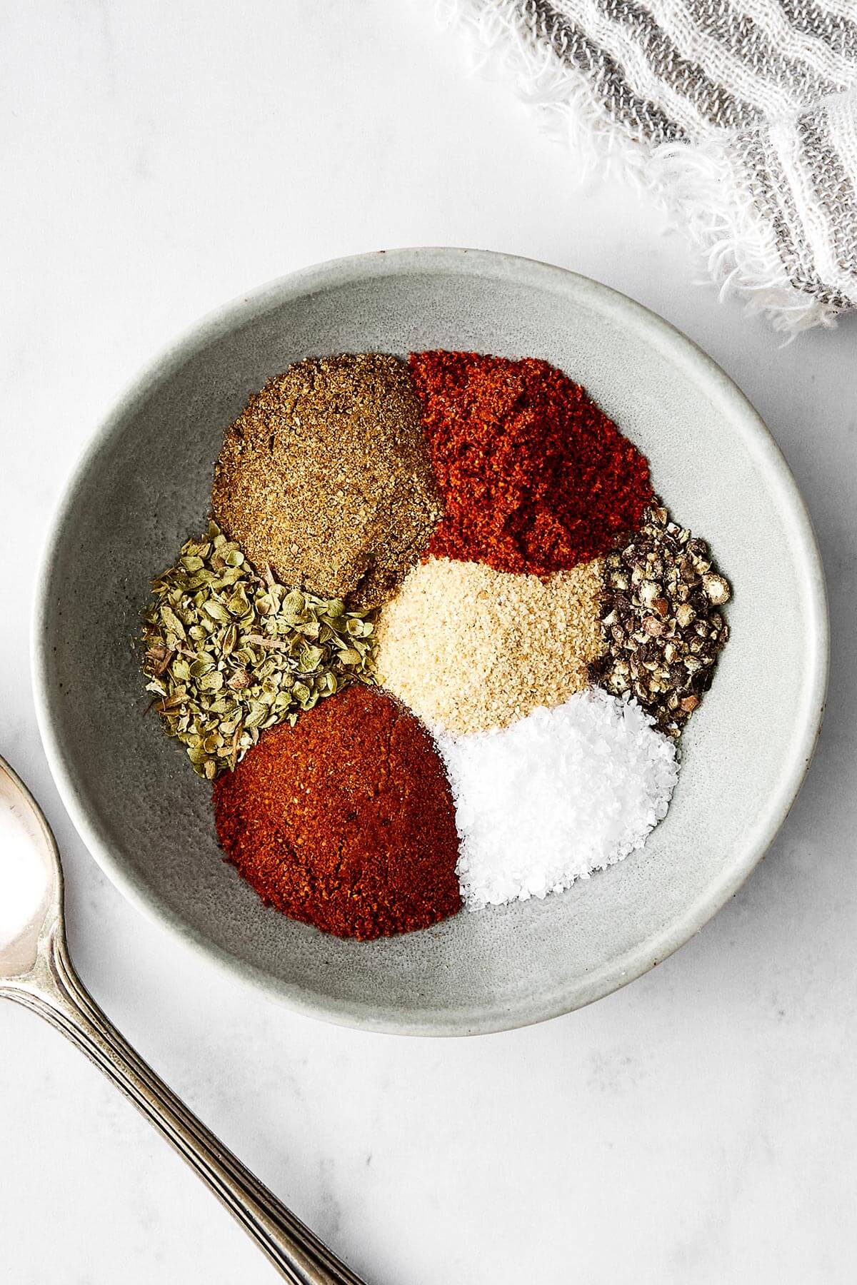 This fajita seasoning beats store-bought packets all day—from flavor to quality, and more! It'll be perfect for all sorts of fajita recipes. Fajita seasoning ingredients in a bowl.