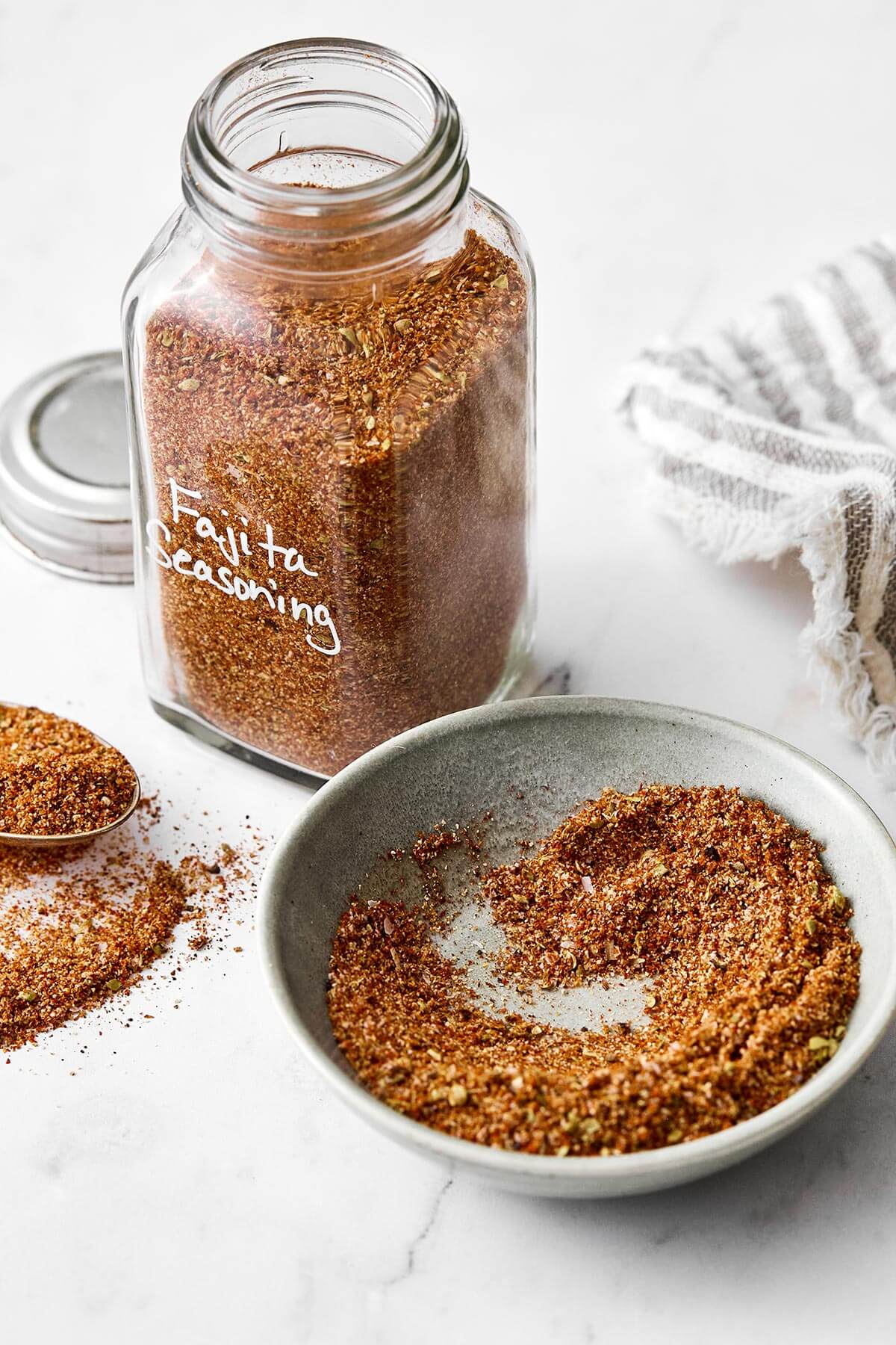 This fajita seasoning beats store-bought packets all day—from flavor to quality, and more! It'll be perfect for all sorts of fajita recipes. Fajita seasoning in a jar.
