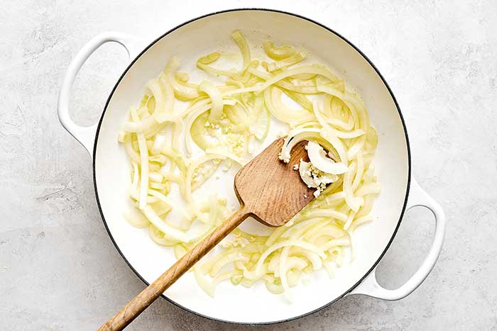 Cooking onions in a pan.