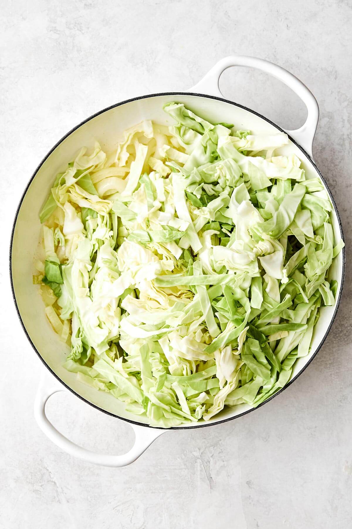 Cooking cabbage in a pan.
