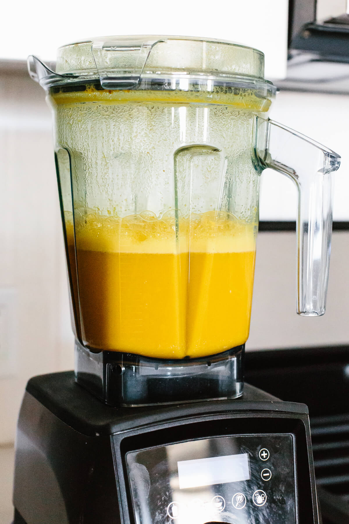 Jamu juice is an Indonesian anti-inflammatory drink that's a blend of fresh turmeric, ginger, lemon, water, and honey. Blending jamu juice in a Vitamix.