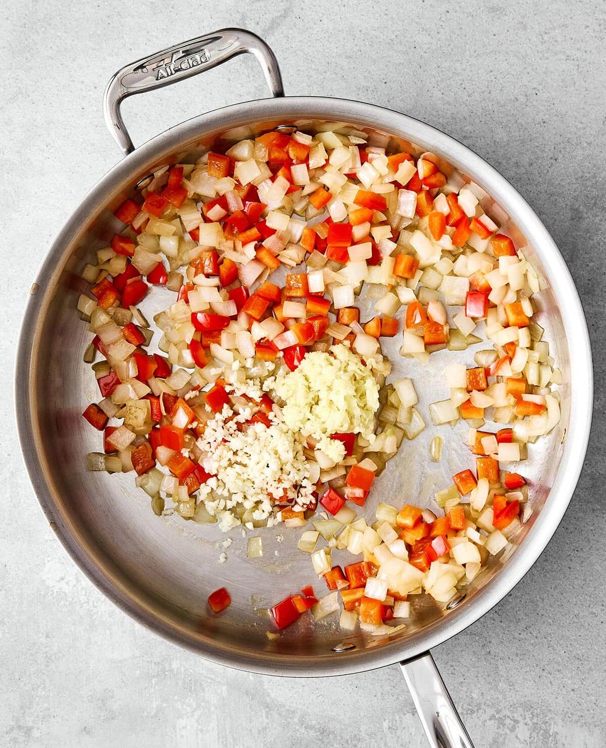 Cooking aromatics in pan.