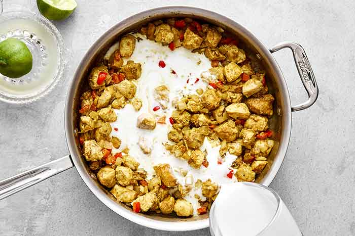 Cooking coconut curry chicken.