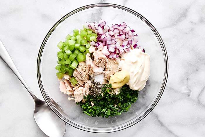 A bowl of tuna salad ingredients.