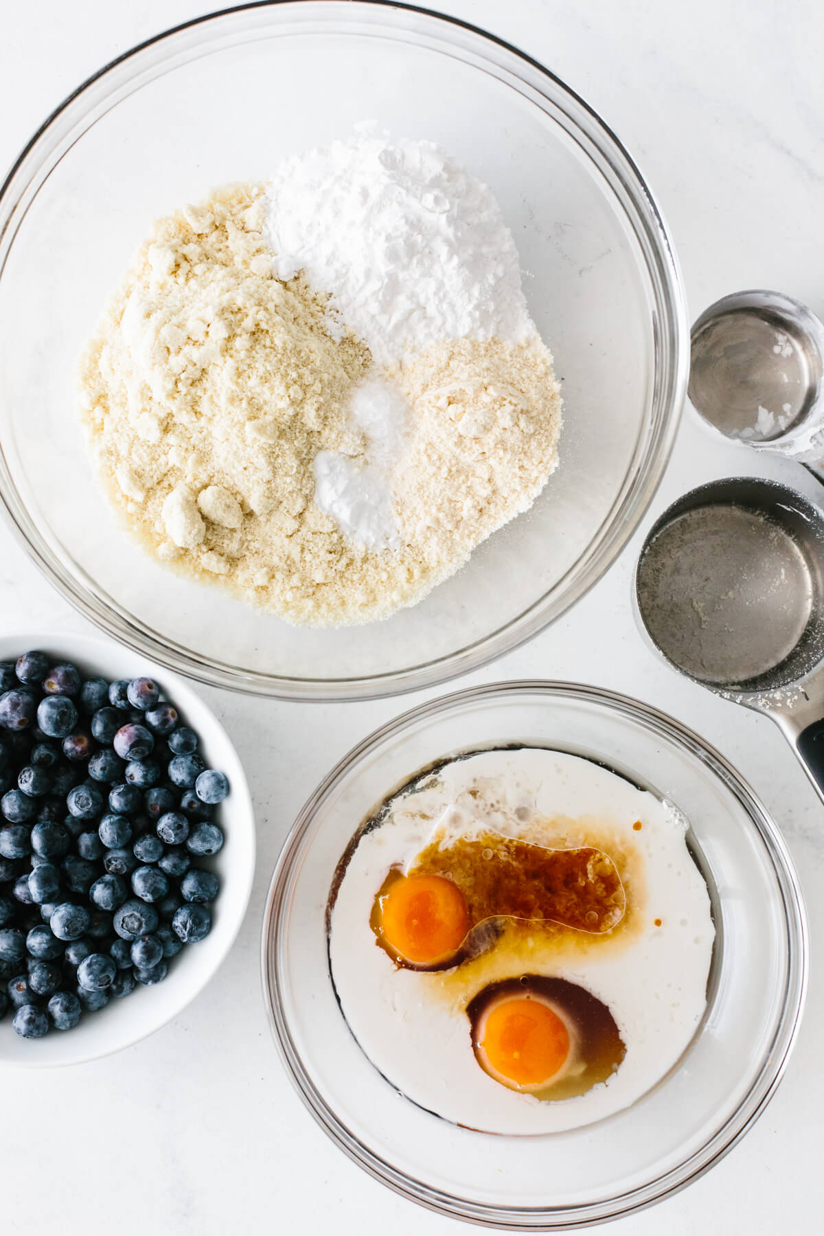Paleo blueberry muffins ingredients in bowls.