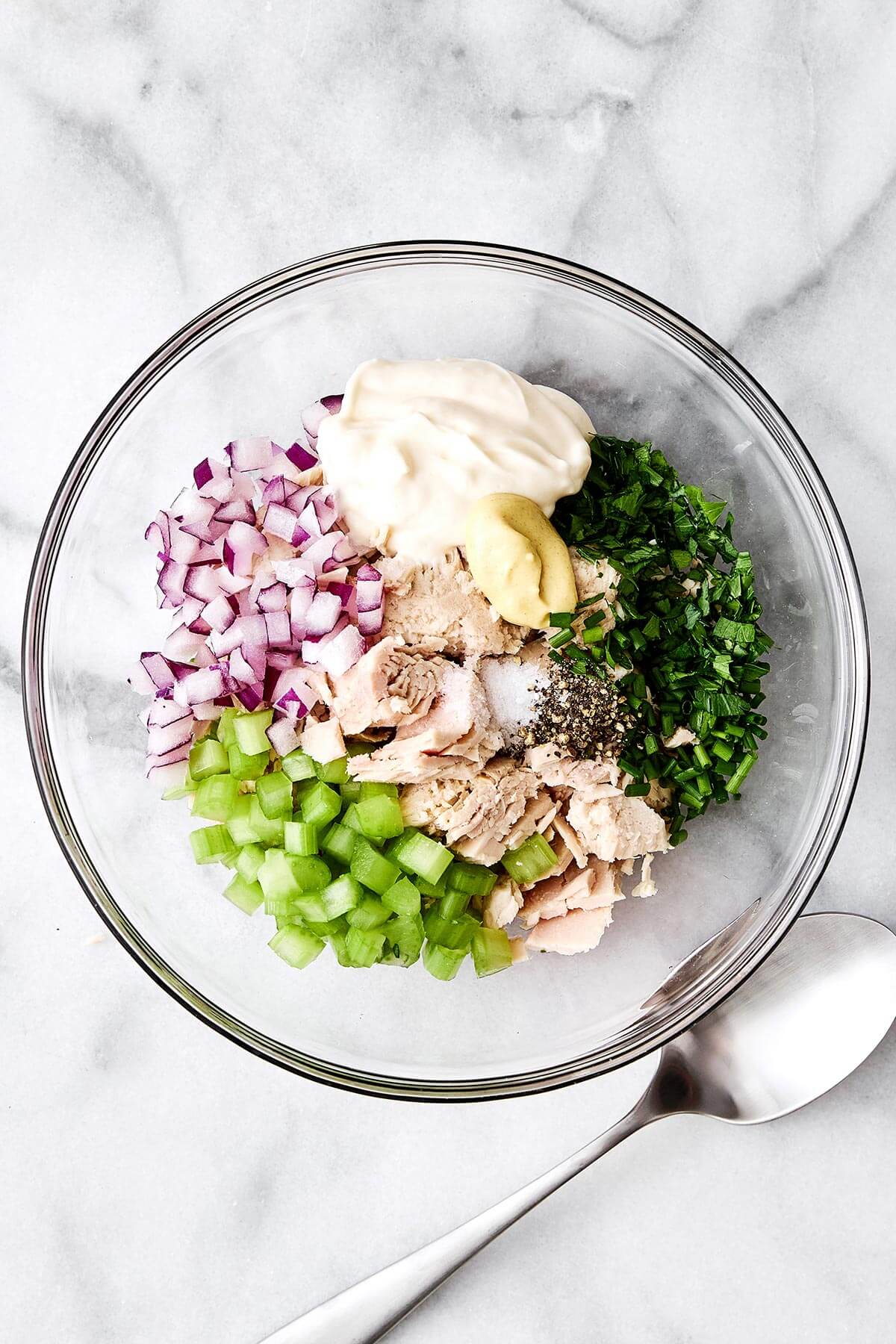 Tuna salad ingredients in a bowl.